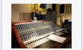Neve 5305 20-channel console close-up showing channel strips, AUX sends, PAN and GAIN controls