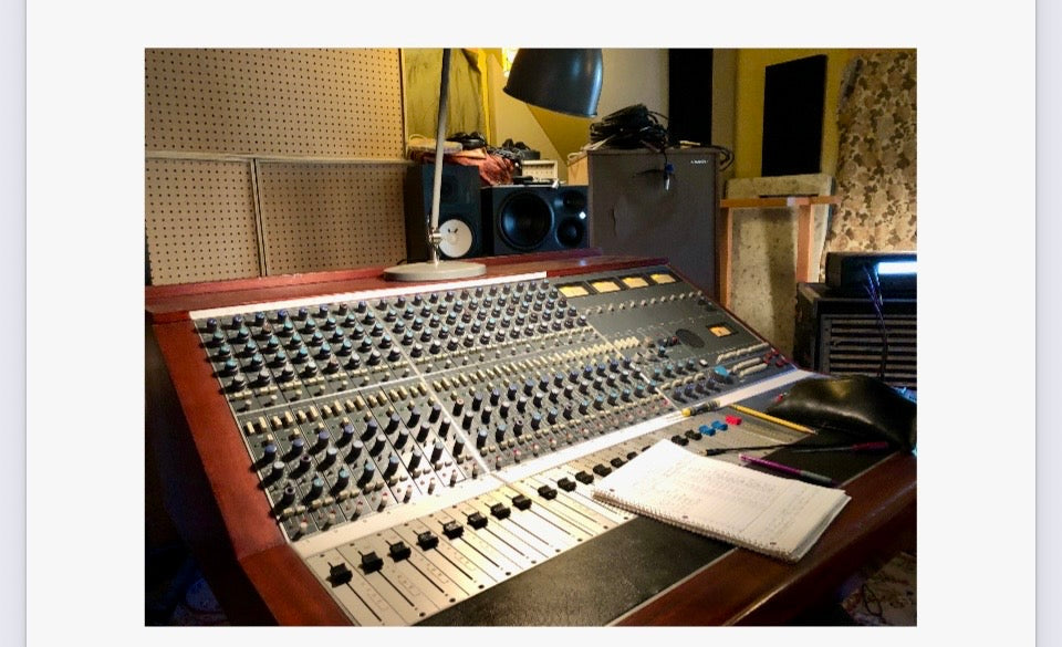 Neve 5305 20-channel console close-up showing channel strips, AUX sends, PAN and GAIN controls